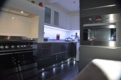 modern kitchen with floor lights